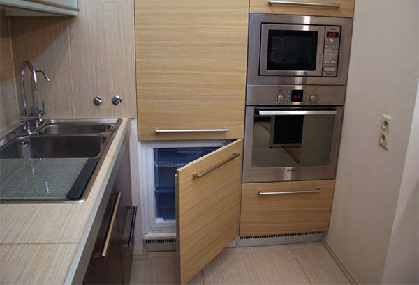Refrigerator in the kitchen cupboard Small fridge