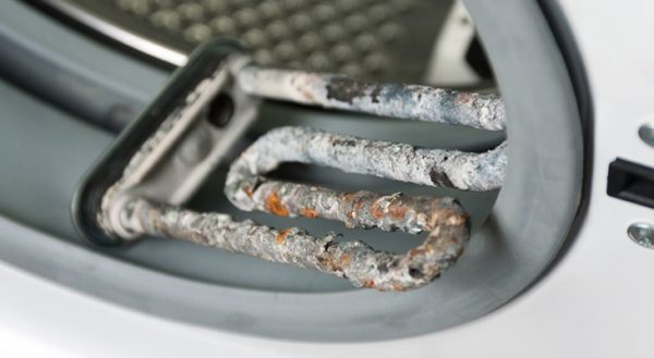 Scale on Heater Scum on the heating elements of the washing machine
