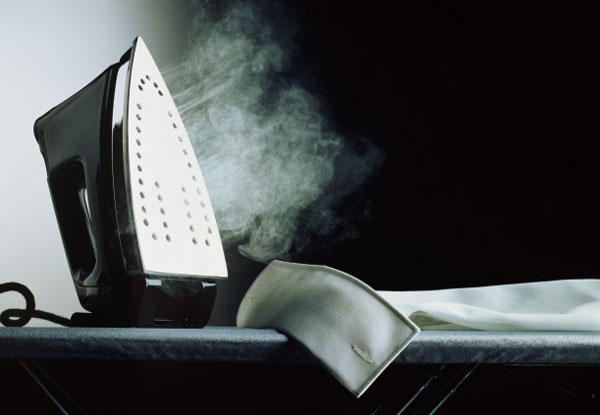 Iron on the ironing board