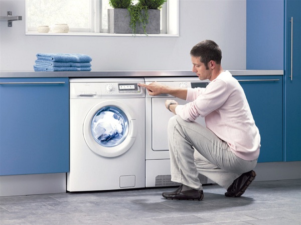 Man and washing machine