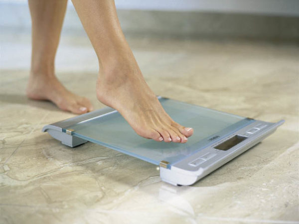 Turning scales on by touch