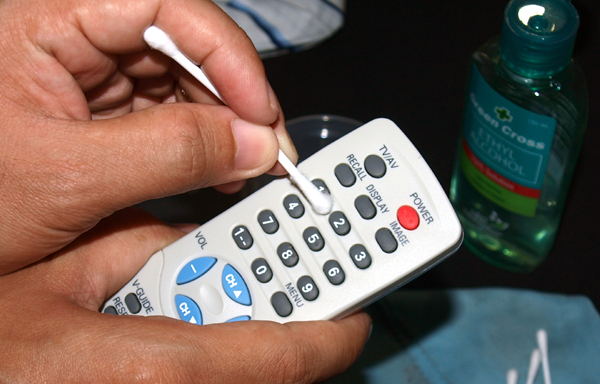 We clean the buttons with a cotton swab