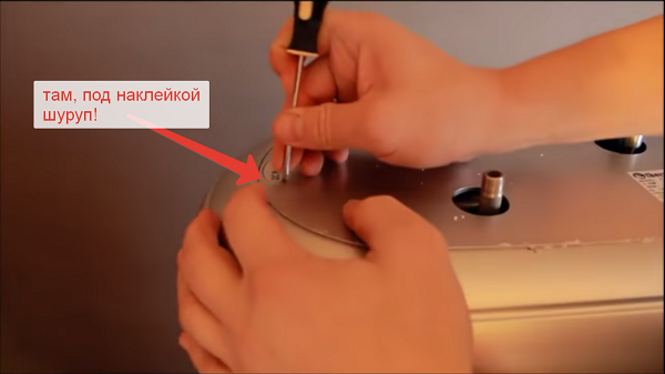 Screw under the sticker