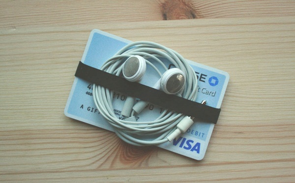 Plastic card and rubber