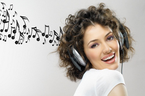 Girl listening to music on headphones