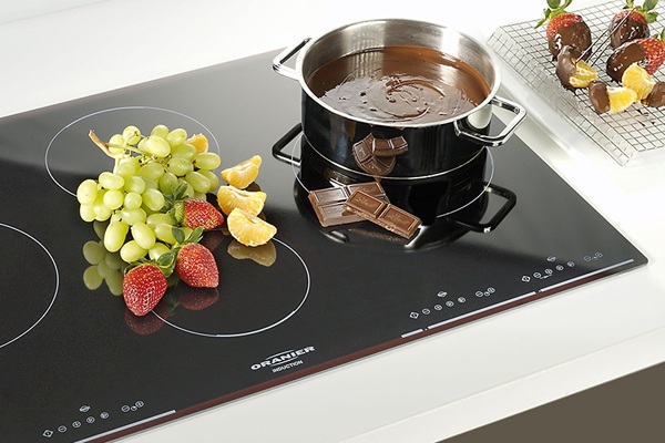 Casserole and fruit on an induction cooker