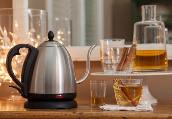 Electric kettle and tea in a cup