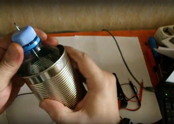 Tin can with plastic bottle