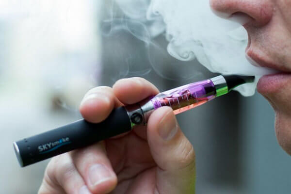 Man smoking vap
