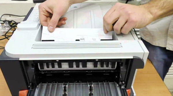 Paper is jammed by the printer.