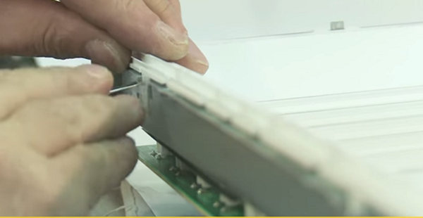 Unscrewing the front frame