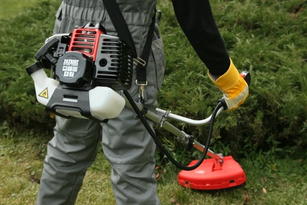Petrol trimmer at work