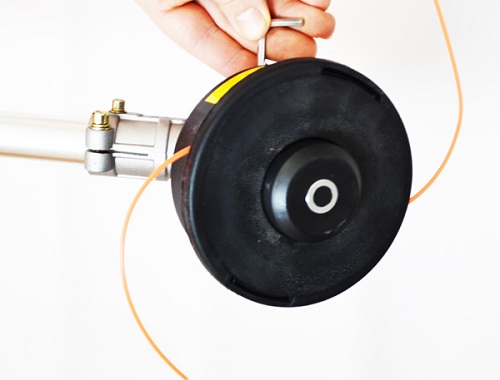 Unscrew the spool with fishing line