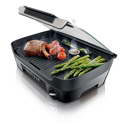 Grill with spice tank and liquid
