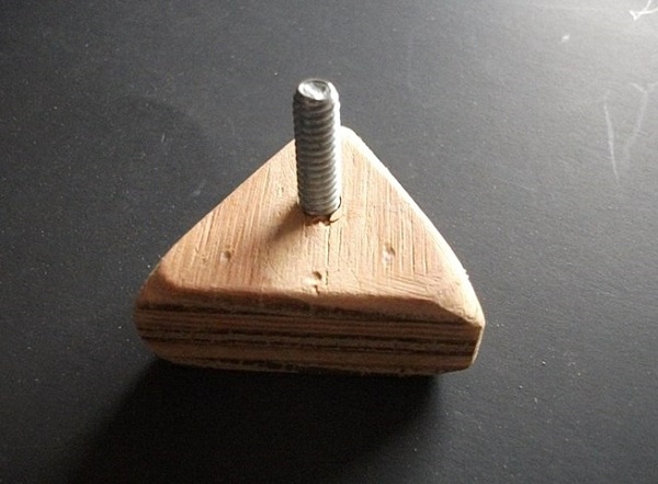 Wooden block with bolt