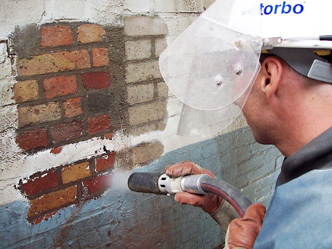 Sand blasting on concrete