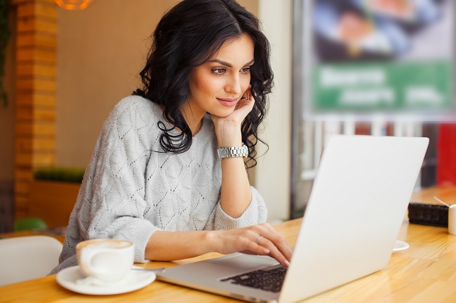 Girl behind a laptop